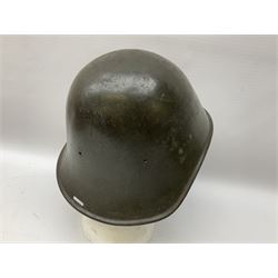 WW2 French M-26 Adrian Pattern Steel Helmet, original olive drab paint finish; flaming grenade badge to the front signifying issue to an Infantry regiment; original leather liner and leather chinstrap; and WW2 Dutch steel helmet with liner and chin strap (2)