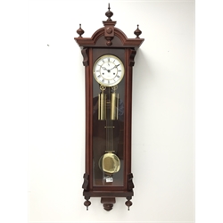  Mahogany Vienna type wall clock, arched case with turned finials, Roman dial with subsidiary seconds, Kieninger twin train movement half hour striking on a coil, two brass weights and pendulum, H123cm, W32cm  