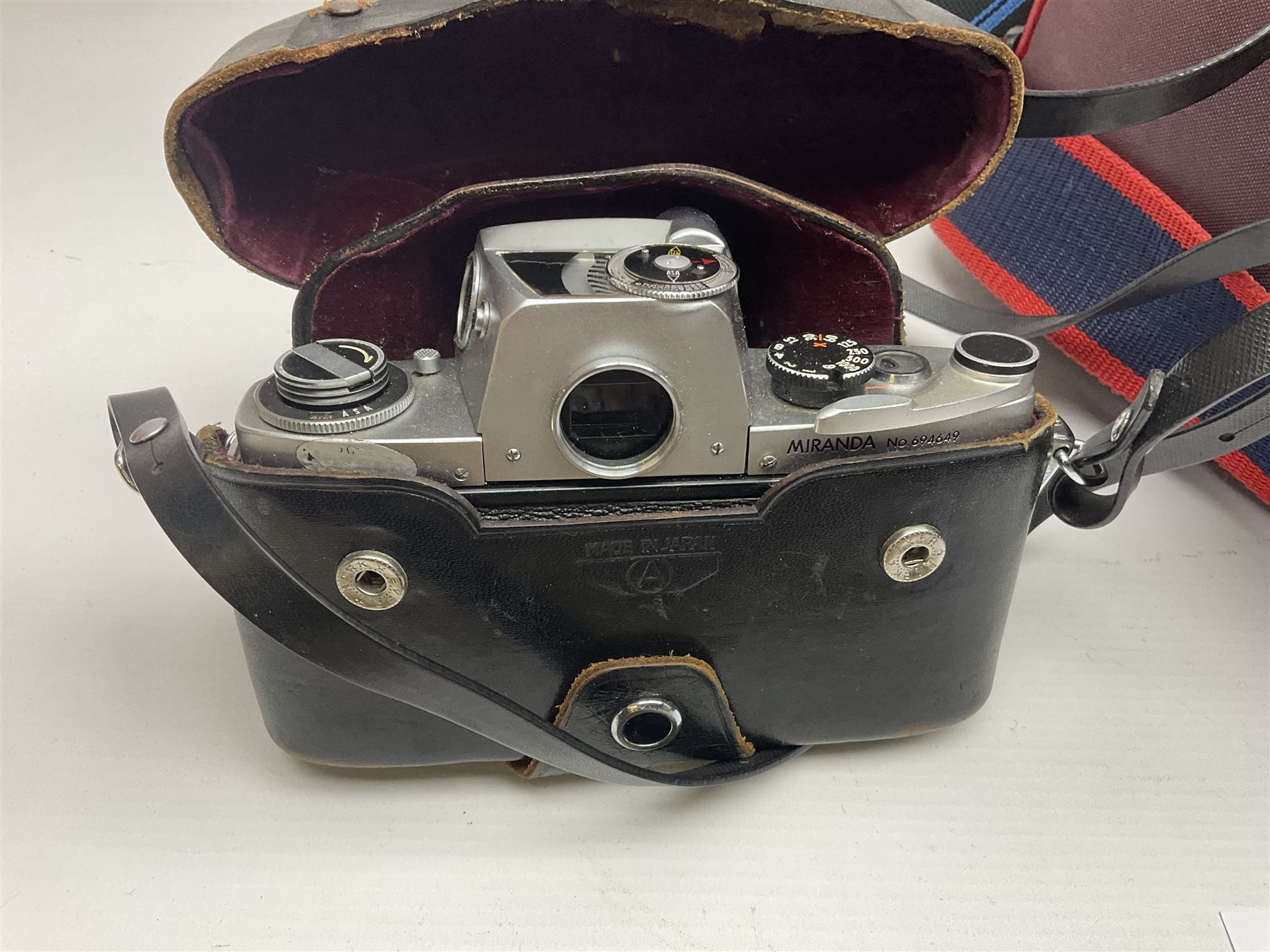 Cameras and accessories, to include Olympus OM101 Power Focus camera body, serial no 1076067, with 'Sigma AF Zoom 1:38, f=75 200mm' lens, serial no 2053714, Canon EOS 5000 camera body, serial no 1507812, with 'Canon Zoom EF 80-200mm, 1:4.5-5.6' lens, other cameras, by Miranda, Coronet and Ricoh and a collection of lenses, carry cases, etc 