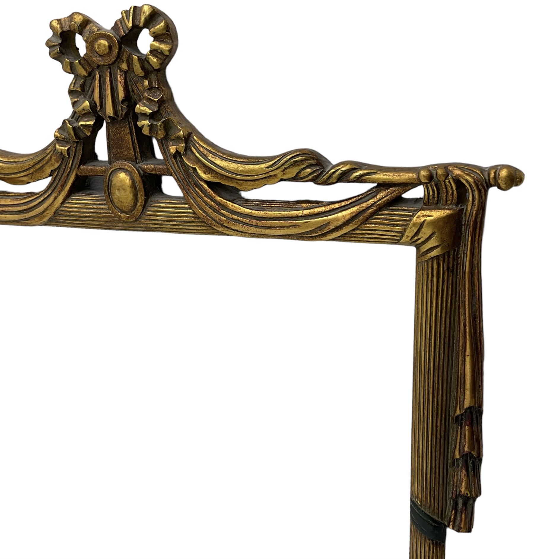 Regency design gilt framed wall mirror, ribbon pediment over hanging linen swags, bevelled mirror plate enclosed by reed moulded frame 