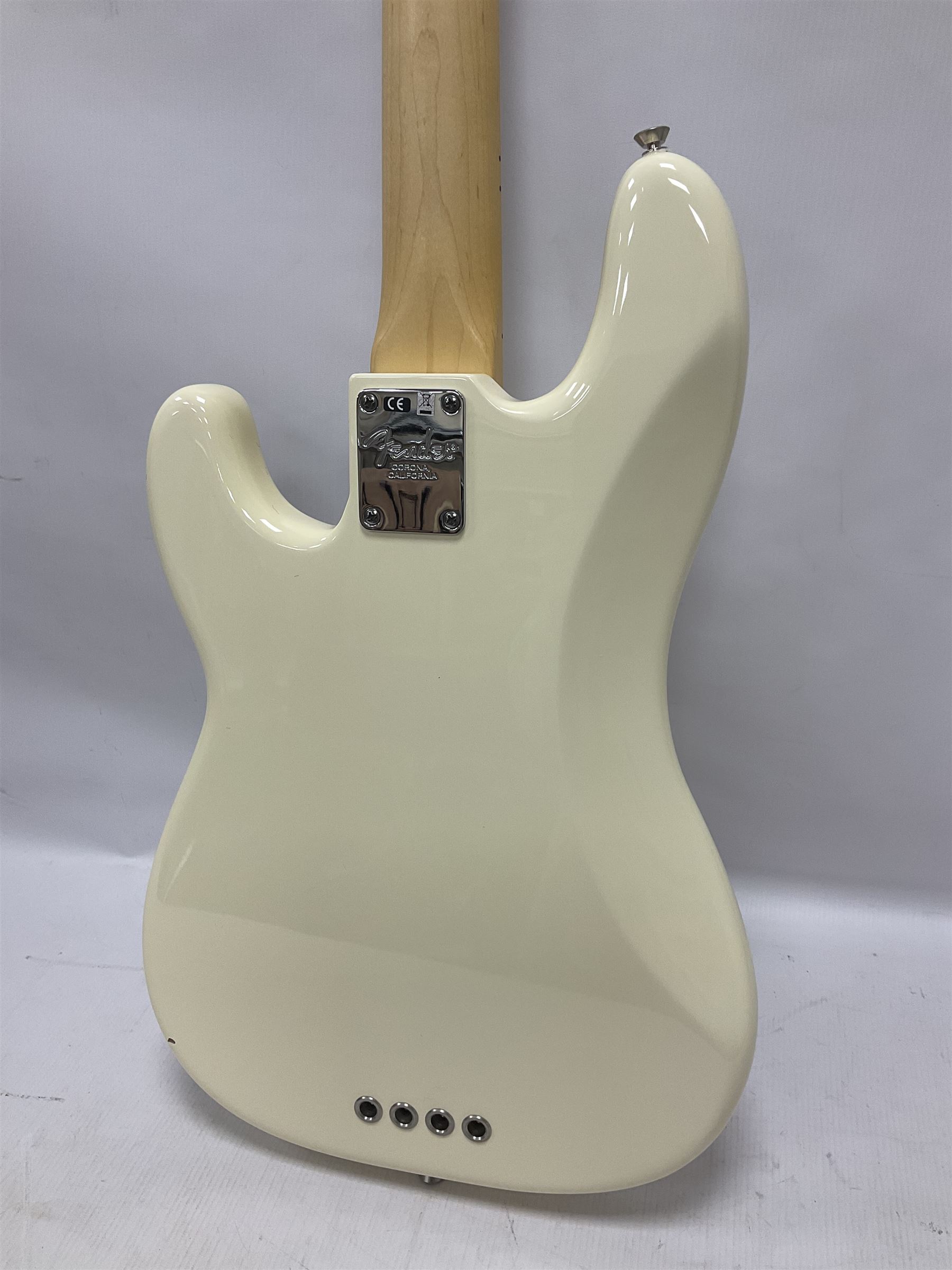 Fender Precision Bass guitar, in Olympic White finish with tortoiseshell effect scratchboard, serial no US15103092, in black Fender hard case with Fender strap and warranty card, guitar L116cm