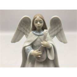 Three Lladro figures, comprising Dear Santa no 6166, Angelic Melody 1993 no 5963 and Seraphs Head no2 no 4885, together with Lladro plaque Love Brings Us Together no 7677, all with original boxes, largest example H18cm