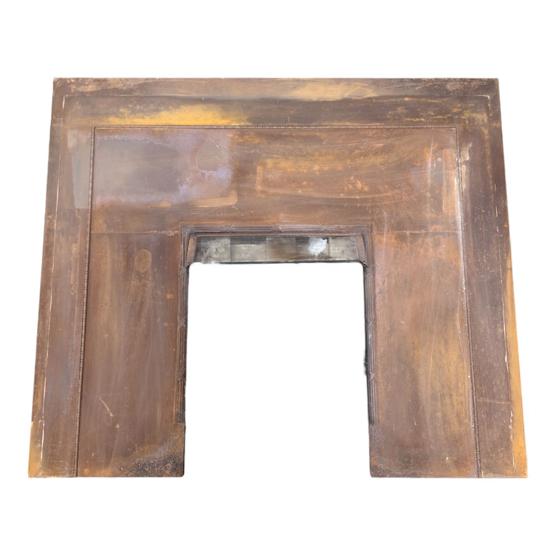 Two cast iron fire surrounds / inserts along with four metal surround pieces 