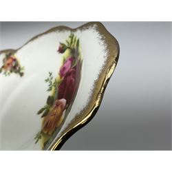 Royal Albert Old Country Roses pattern tea set, comprising teapot, coffee pot, six teacups and six saucers, five side plates, further teacup with joined saucer and side plate, open sucrier, milk jug, cake plate, and preserve pot and cover, together with Royal Albert Jubilee Rose pattern sauce boat and stand, and Royal Albert Lavender Rose pattern cake stand. 