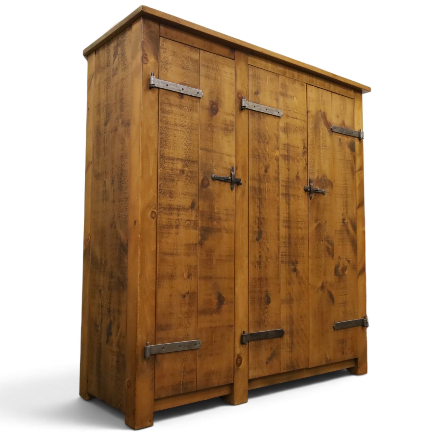 Indigo Furniture - rustic oak triple wardrobe, fitted with three doors with wrought metal fittings and locks, on style supports