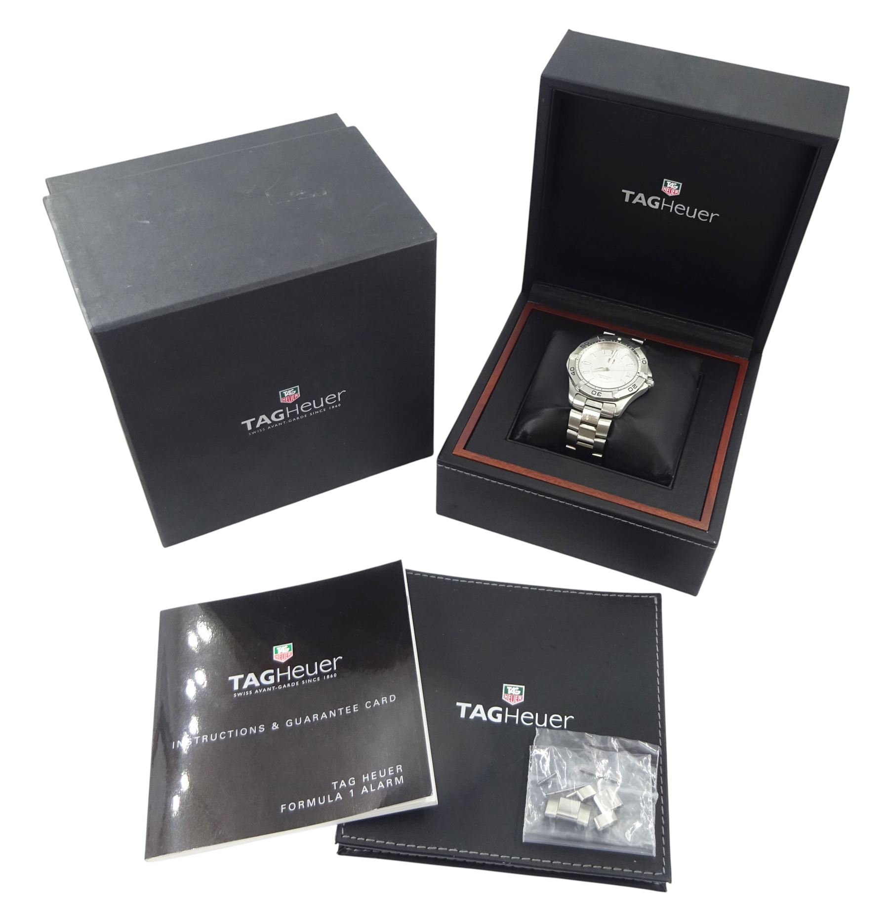 Tag Heuer Aquaracer 300 meters gentleman's stainless steel quartz wristwatch, Ref. WAF112, silvered dial with dagger hour markers and date aperture, on original stainless steel bracelet , with fold-over clasp, boxed with additional links and guarantee card dated 2007