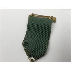 Made-up group of three WWI medals comprising 1914 Star awarded to 23598 Gnr. F. Jefferson R.G.A., British War Medal and Victory Medal with names removed; with ribbons on wearing bar; 1942 Motorist's Medal and small quantity of cap badges, Royalty badges etc