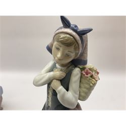 Three Lladro figures, comprising Boy from Madrid no 4898, Nature Bounty no 1417 and Purrfect Friends no 6512, all with original boxes, largest example H24cm