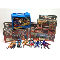 Three Hasbro Transformers figures - Ultra Magnus, Optimus Prime and Firebolt, all boxed; Transformers lunchbox; and quantity of loose He-Man and Skeletor action figures etc