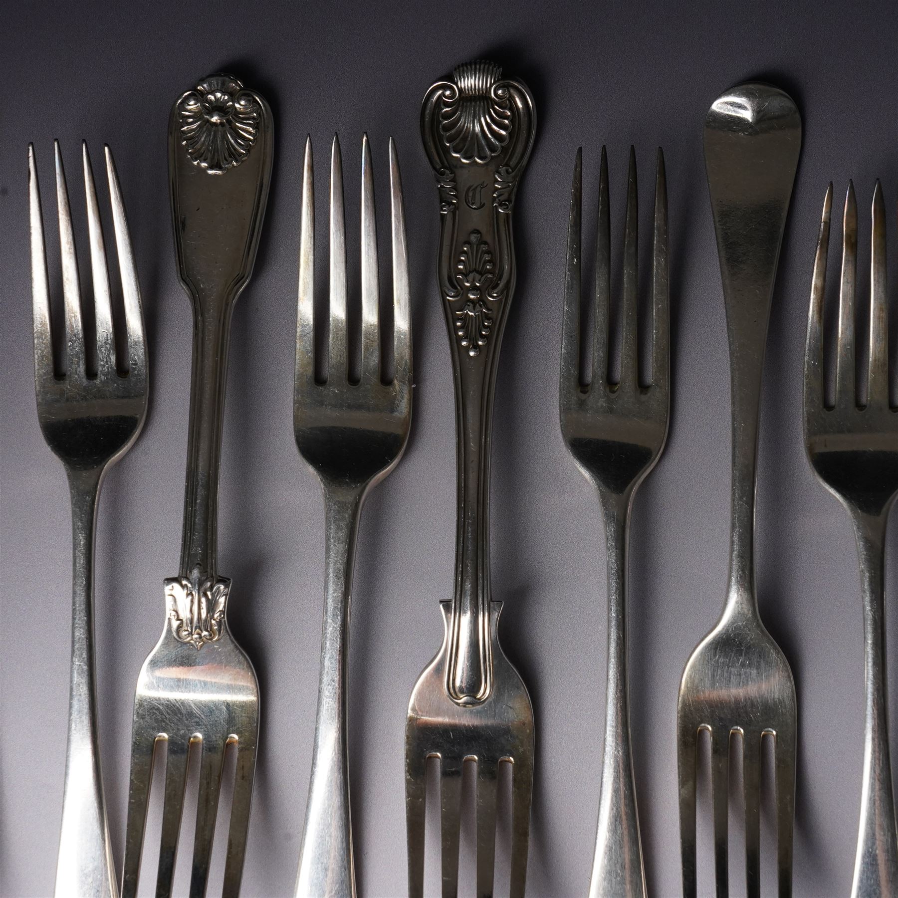 Pair of George IV silver fiddle, thread and shell pattern table forks Lonson 1826 and ten other 19th century silver table forks, various dates and makers (12)