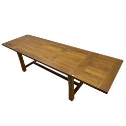 Manor Oak - light oak rectangular dining table, with two leaves.