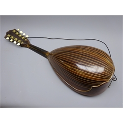  Late 19th/early 20th century Italian lute back mandolin with segmented rosewood back and spruce top, eight brass and bone pegs and four strings, bears label for Giuseppi Puglisi Catania, L61cm, in carrying case with detached top  