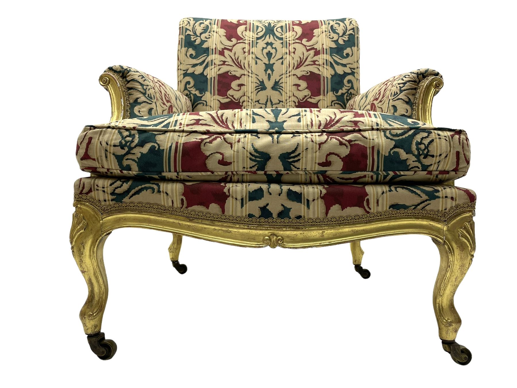William Bertram & Son of London - pair late 19th century giltwood armchairs, moulded frame with scroll carved back and arm terminals, upholstered in striped fabric with foliate pattern, on shell carved cabriole supports, the brass castors stamped 