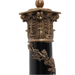 Victorian copper and brass fire hose branch, converted to a table lamp, on circular wooden plinth, H63cm together with a 20th century brass and ebonised corinthian column table lamp, with vine entwined stem and leaf cast square base, both with mottled glass shades (2)