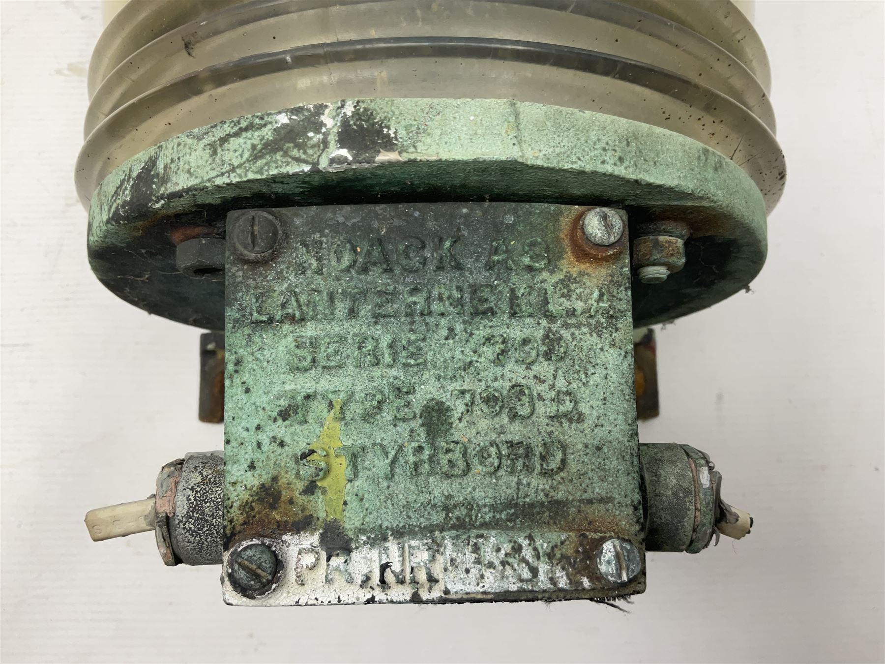 Two port and starboard brass lamps, each with a plaque marked 'Noack as Lanterne KL.A Serie 700 Type 704D Babord', ribbed green and red glass shades, H44cm