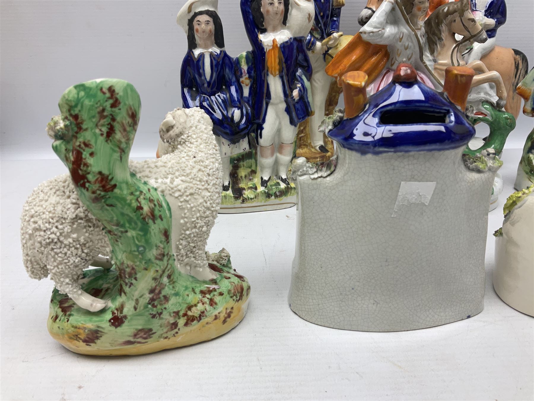Quantity of Victorian and later Staffordshire style figures, to include examples upon horseback, sheep, drummer etc