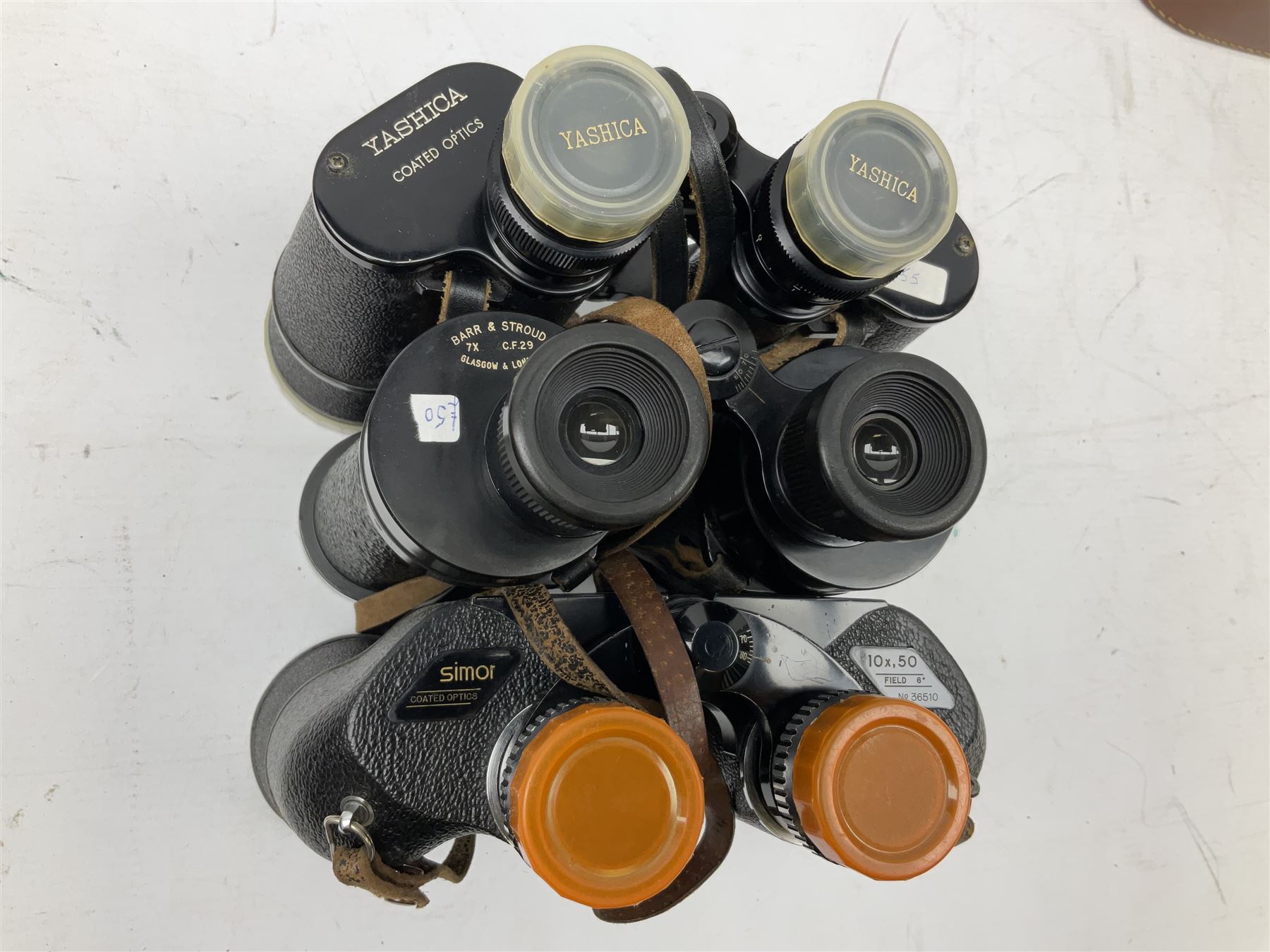 Ten cased pairs of binoculars, to include Rainbow 20x60, Barr & Stroud 7x, Yashica 7x50, Ross London Stepmur 10x50, Wray London Defiant 10x35, Canon 8x30 etc