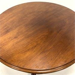 Victorian mahogany breakfast table, circular moulded tilt top on turned pedestal, four shaped out splayed supports with scroll carved terminals, brass and ceramic castors