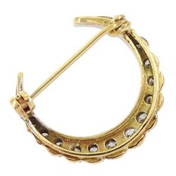 9ct white and yellow gold round brilliant cut diamond crescent brooch, London 1977, total diamond weight approx 0.55 carat