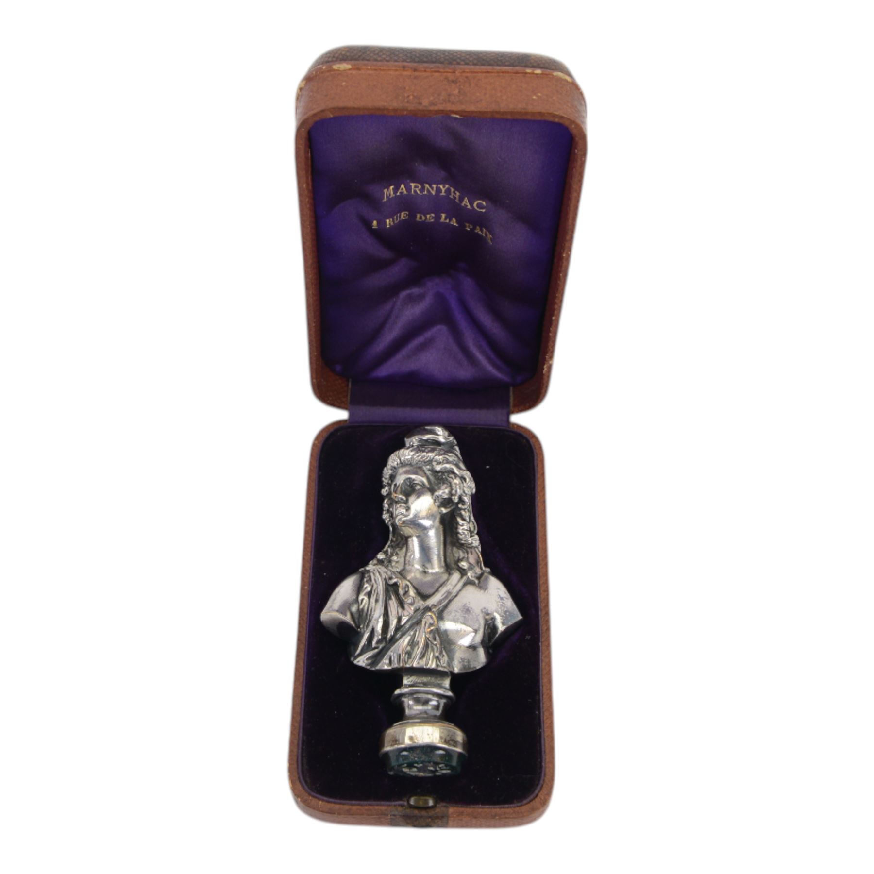 19th century French silver plated seal, modelled as a bust of Attis, Consort of Cybele after Jean Baptiste Clesinger, cast by the Marnyhac foundry, the bloodstone stamp with crest and Latin motto 'Festina Lente' (make haste slowly), H10cm, contained within original maker's fitted brown leather box with purple silk and velvet lined interior detailed 'MARNYHAC 1 RUE DE LA PAIX' 

Provenance: From the collection of Andrew Chichester Everitt.