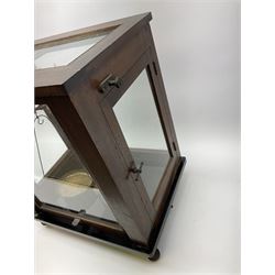 Set of laboratory balance scales by Paul Bunge Hamburg Model 9A No.7977 bearing label for Reynolds & Branson Leeds in mahogany case with upward sliding front door, two hinged side doors, hand cranked rise-and-fall facility and black vitrolite base L36cm H42cm D26cm; and two boxed part sets of weights (3)