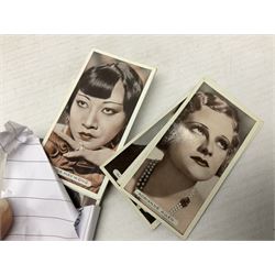 Quantity of mostly cigarette cards, housed in ring binder albums and loose, by Ardath, W.D. & H.O. Wills, John Player & Sons, The American Tobacco Co etc, including famous film stars, cinema stars, wild birds, poultry, dogs etc and various books or catalogues relating to cigarette card collecting, in one box