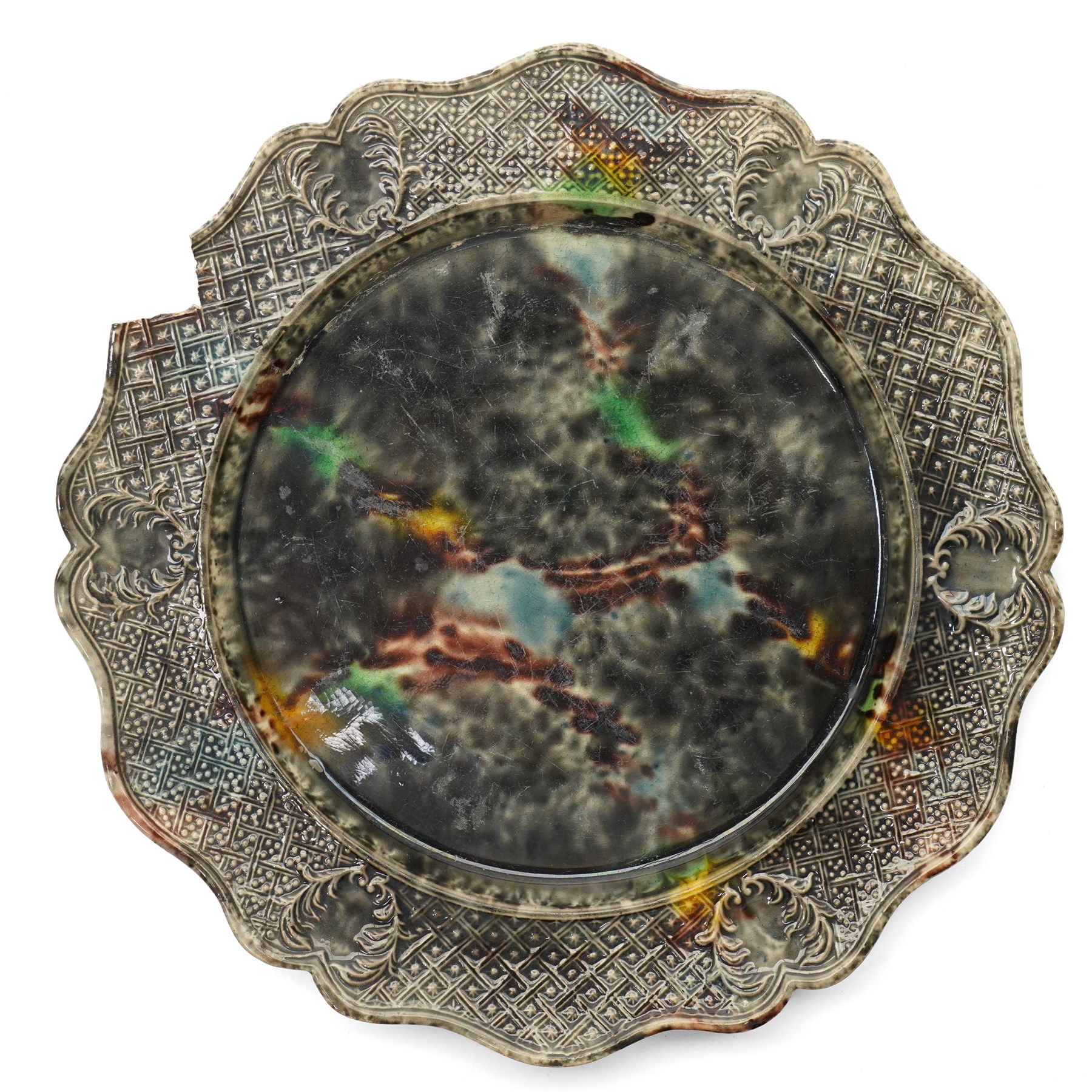 Pair of 18th century cream ware Whieldon type plates decorated with a mottled tortoiseshell glaze D20cm and two other similar plates of shaped circular design