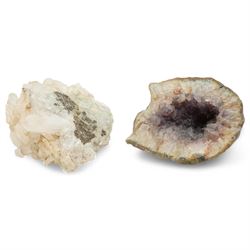 Two amethyst geode clusters, with white and purple crystalline formations, purple formatio...