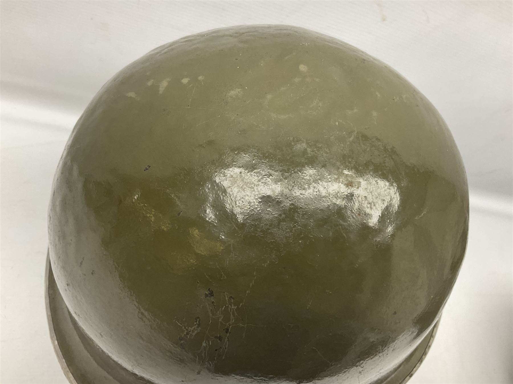 1950s French Algerian War steel helmet with liner; indistinctly marked 'S.I.A. LE EANS(?) 71R'