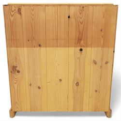 Contemporary waxed pine bureau, fall front enclosing fitted interior with pigeonholes and drawers, over two short and three long drawers with turned wooden knobs, on plinth base