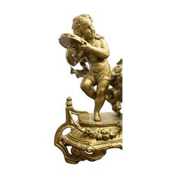 French - late 19th century 8-day  spelter mantle clock depicting two dancing children and a pair of nesting doves, white enamel dial with Roman numerals and steel moon hands, countwheel striking movement striking the hours and half-hours on a bell. With pendulum. 