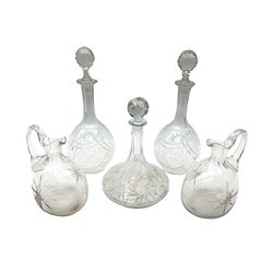 Pair of cut glass decanters and stoppers, together with a cut glass ships decanter and stopper, and pair of claret jugs with star cut decoration to bodies, in one box, (5)