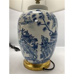 Table lamp of baluster form, decorated with a Japanese landscape on a white ground raised upon a gilt footed base, including shade H65cm