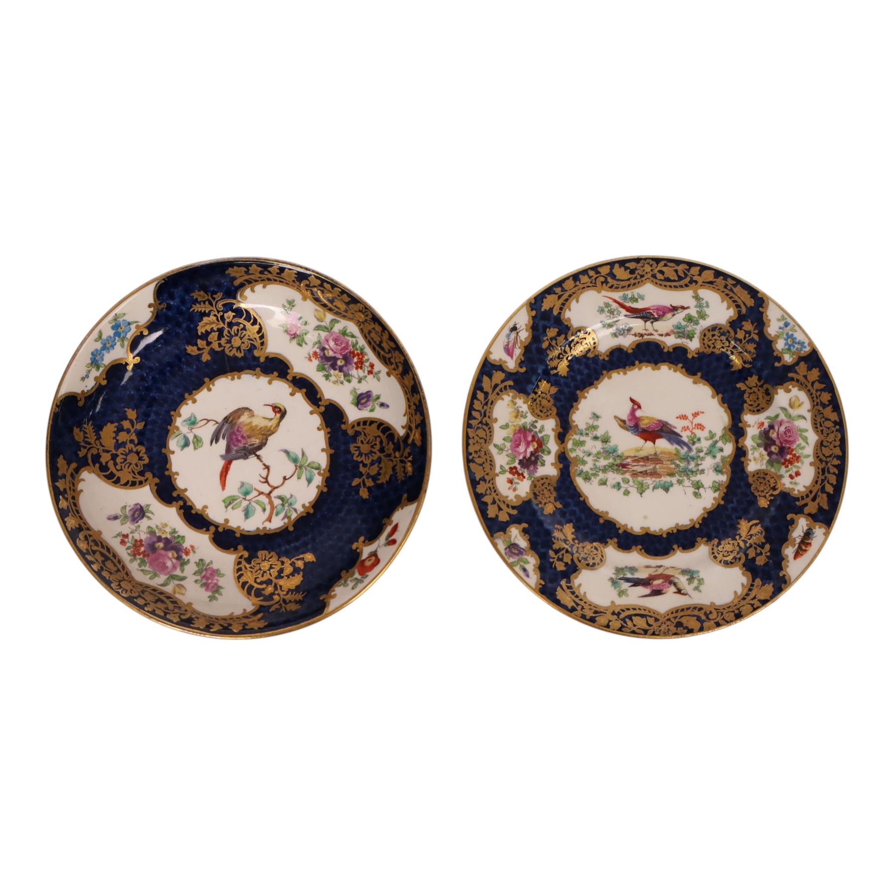 18th century Worcester trio, circa 1770,  painted with shaped panels of birds within a gilt boarder upon a blue scale ground with gilt detail to the rim, mark beneath, H7cm 