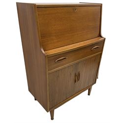 Mid-20th century teak bureau, fall front enclosing fitted interior, single drawer over double cupboard 