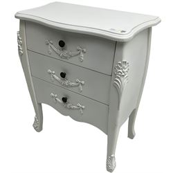 French design white painted chest, shaped top over three drawers, each with applied swags with flower heads, flanked by cabriole uprights with foliate mouldings