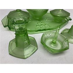 Czech uranium glass dressing table set, comprising twin handled tray, pair of candlesticks, three lidded jars and ring holder dish, and a blue Finnish Riihimäki glass, tray L35cm
