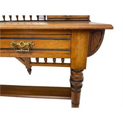 Late Victorian Aesthetic Movement walnut and inlaid ebony dressing table, swing mirror back with shell carving and spindle support rail, fitted with two trinket drawers and single frieze drawer, raised on ring turned supports with castors