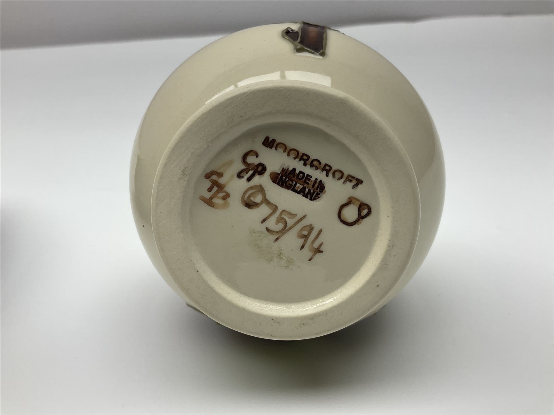 Moorcroft dish and cover, of circular form, decorated in Buttercup pattern, together with a Moorcroft vase, of baluster form, decorated in Magnolia pattern, both with printed marks beneath, tallest H9.5cm