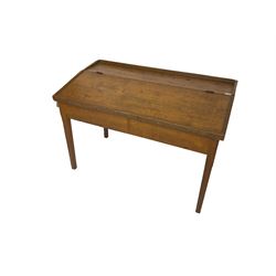 Late 19th century walnut school desk, sloped hinged lid, on square tapering supports 