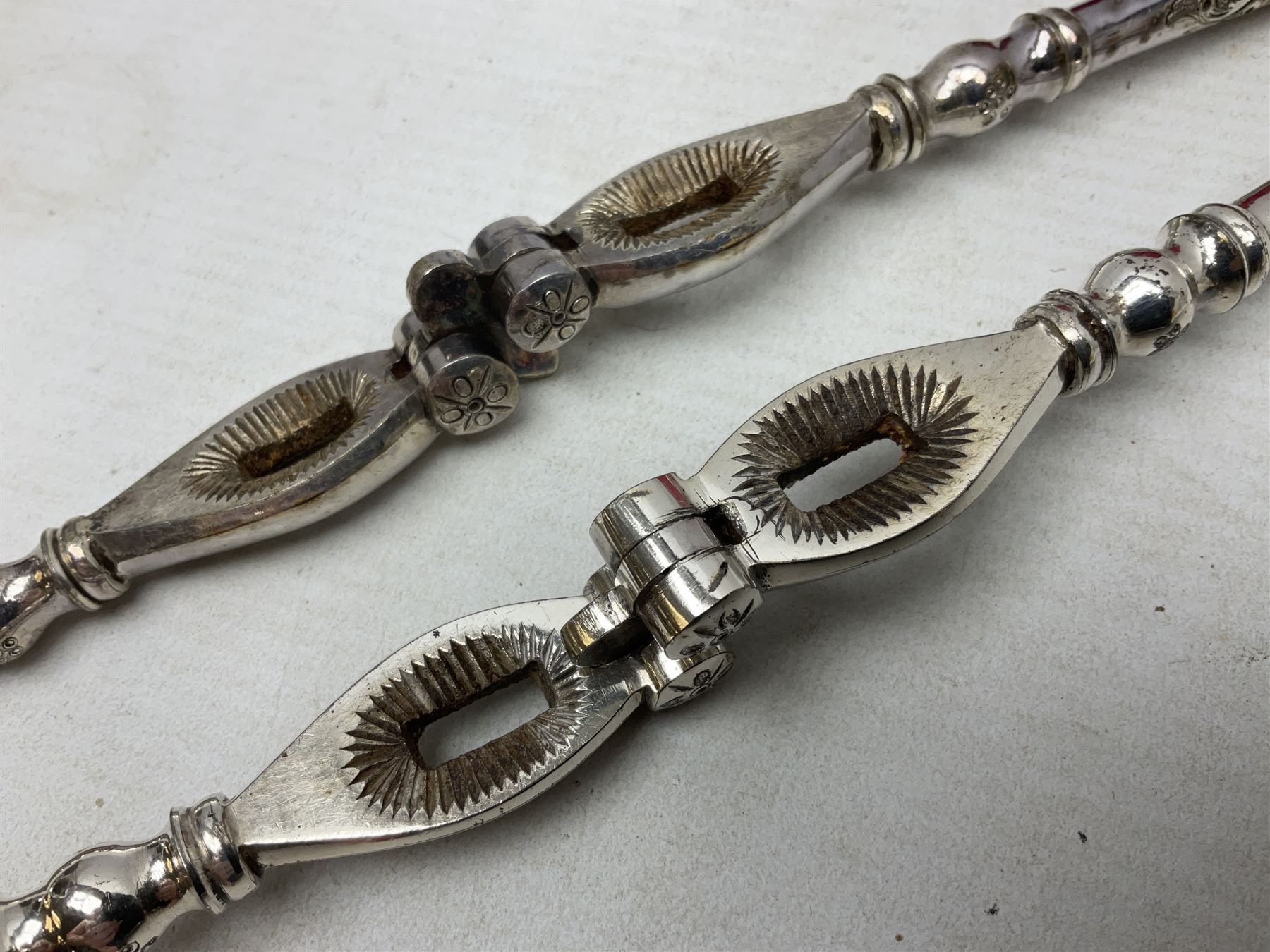 Pair of cased silver plated nut crackers 