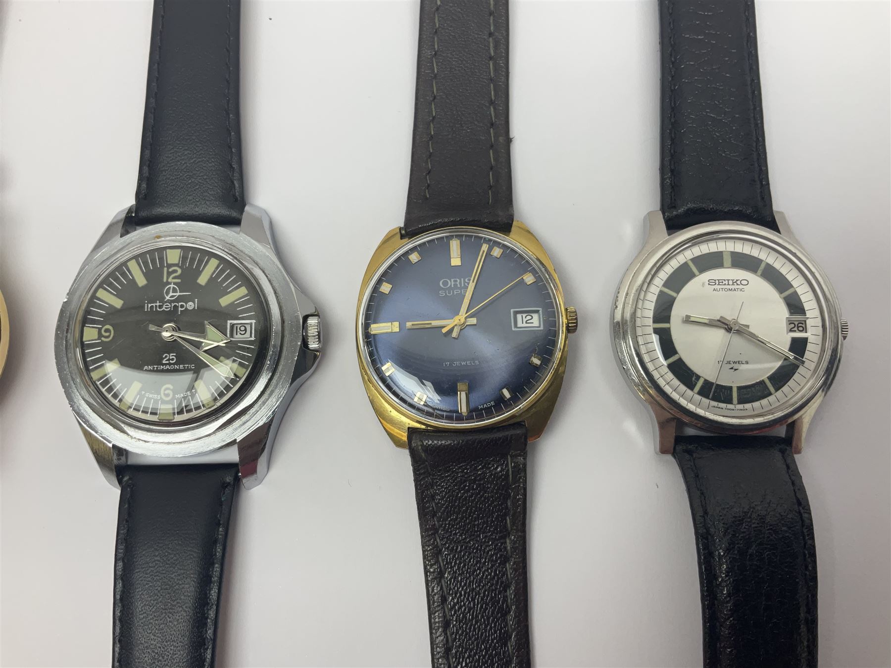 Three automatic wristwatches including Seiko, Debert chronograph and Swiss Emperor and four manual wind wristwatches including Chronograph Swiss, Interpol, Mithras chronograph and Oris