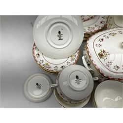 Wedgwood dinner service decorated in the 'Bianca' pattern, to include eight dinner plates, eight bowls, eight side plates, eight twin handled souo bowls, eight soup bowl saucers, eight teacups, eight teacup saucers, six dessert plates and two larger, two twin handled lidded tureens, milk jug, two sauce boats, salt and pepper shakers, oval serving  plate, twin handled sandwich plate, covered sucrier, small rectangular dish and two small circular dishes, all with printed stamp mark beneath