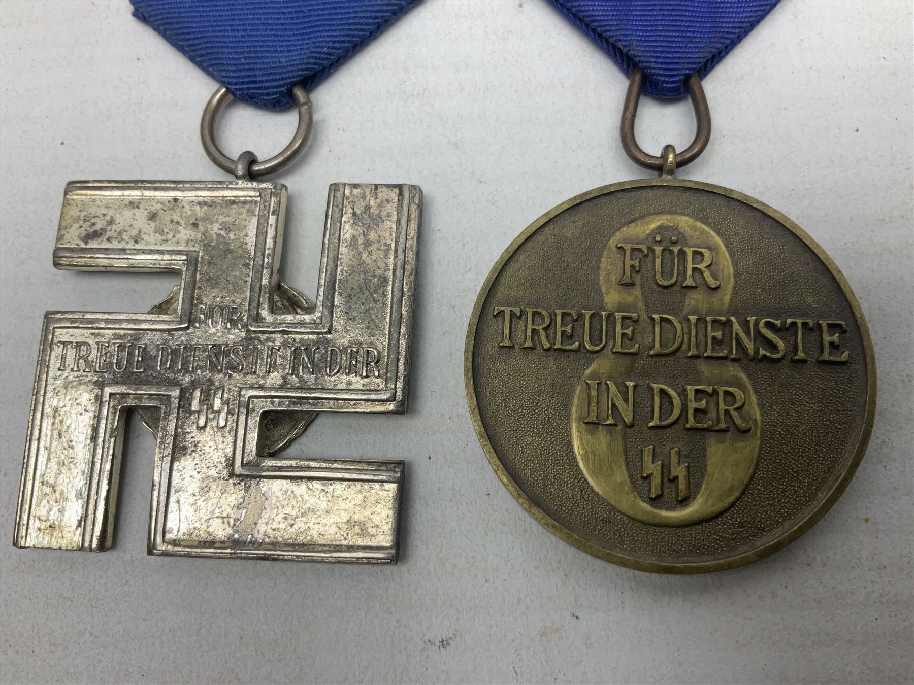 Two post-WW2 copies of German 'SS' Long Service Awards - bronze 8-year medal and silvered 12-year medal; both with ribbons (2)