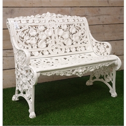  White finish Coalbrookdale style cast iron garden bench, cresting rail with mask above leaf moulded back, scroll decorated seat, W93cm  