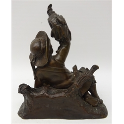  19th century bronze model of a young street performer, the boy laid with a musical instrument, holding a Monkey dressed as a Pierrot, L18cm   