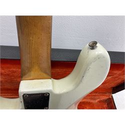 1963 Fender Jazz three-knob bass guitar; impressed with date code 7AUG63A on end of neck and serial no.L08587 on back plate; all original but re-finished in white in the 1970s; sold with photographs of the instrument in the 1960s with original finish and in the 1970s re-finished; L117.5cm; in original hard carrying case; Provenance: the professional guitar of Howard Livett from new to his death in 2005. Howard played in The Humperdincks, the backing group for Englebert Humperdinck, also played in the backing group for Max Bygraves and in the band Hedgehoppers Anonymous. The guitar is also sold with a manuscript letter of provenance from Howard's wife.