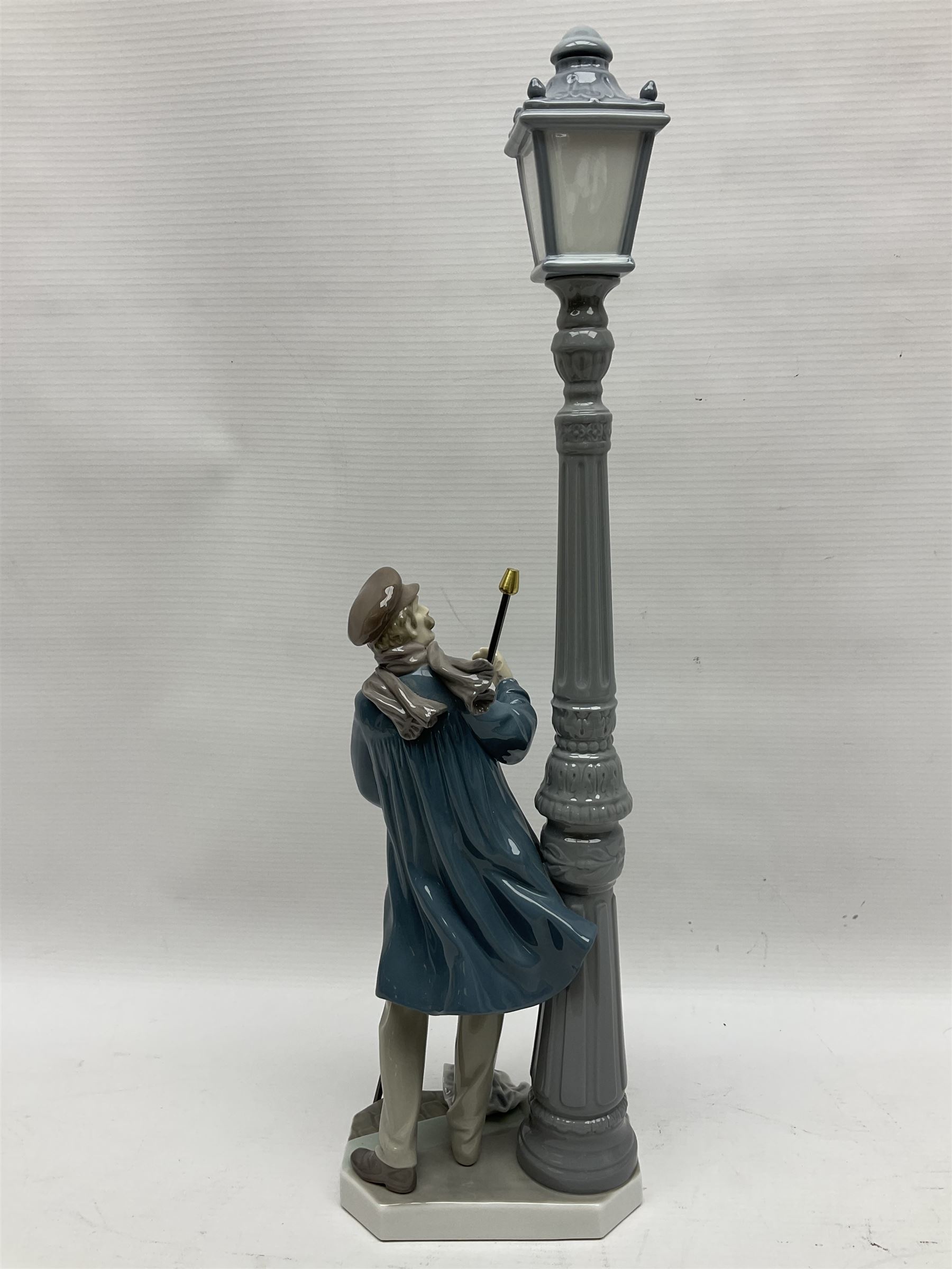 Five Lladro figures, including The Lamp Lighter no 5205,  Girl and Kittens no 6102, Cat no 5113 etc