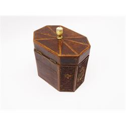 George III mahogany and quillwork tea caddy, of octagonal form, the base decorated with gilded paper scrolls in the form of stylised flowers, within strung chequer border, the hinged cover with turned ivory finial, H12cm W13.5cm D9.5cm