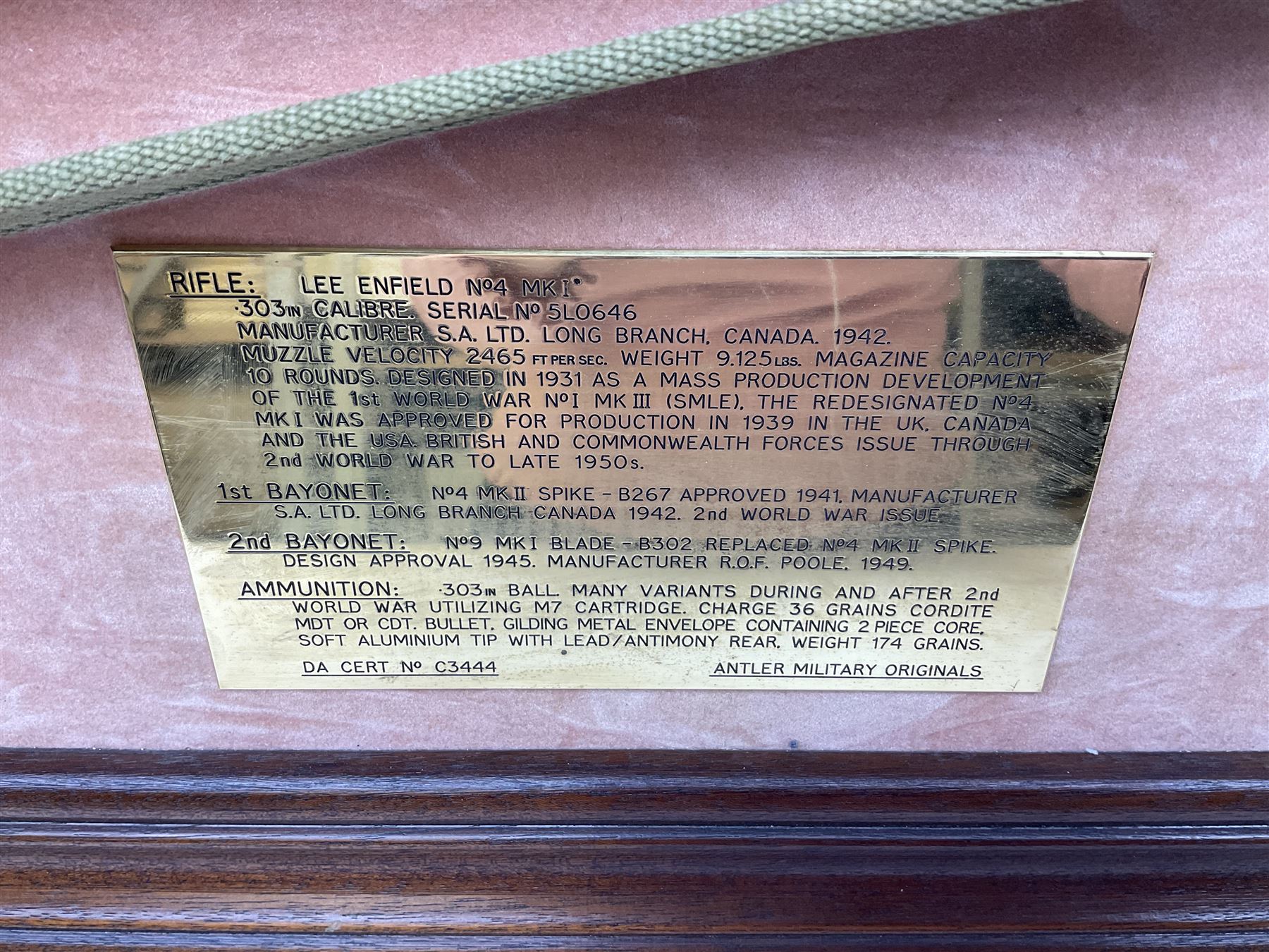 WW2 Lee Enfield No.4 Mk.1 .303 bolt-action rifle with hinged butt compartment, made by SA Ltd., Long Branch, Canada 1942, serial no.5L0646 L113cm; mounted on a framed display board with No.4 Mk.II spike bayonet, No.9 Mk.1 blade bayonet, two inert 5-round clips and brass biographical plaque by Antler Military Originals detailing DA Cert No.C3444 OLD STYLE DEACTIVATION SO FIREARMS CERTIFICATE REQUIRED OR RFD